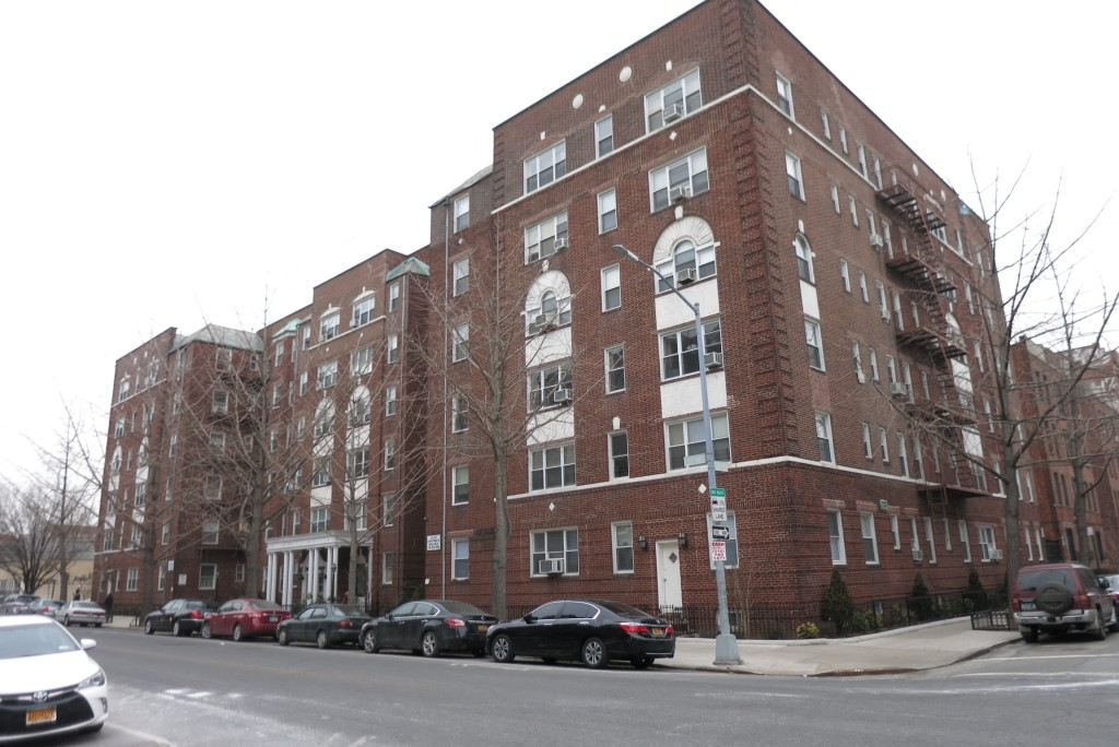 a six-story red brick apartment building