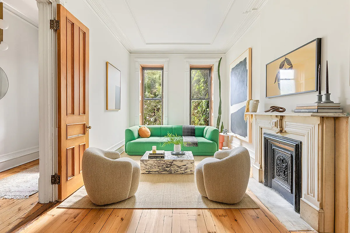 parlor with marble mantel, wood floors