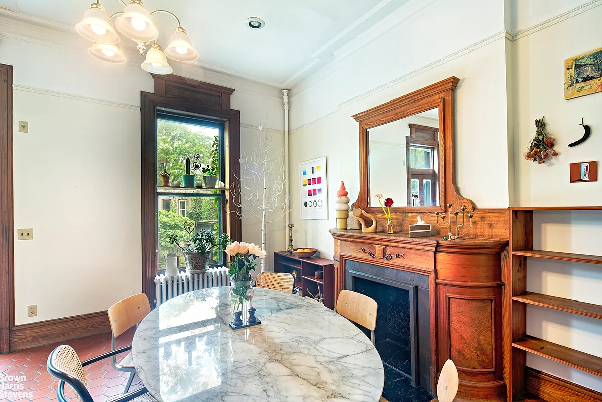 park slope - kitchen with terra cotta tile floor, a wood mantel, and room for dining