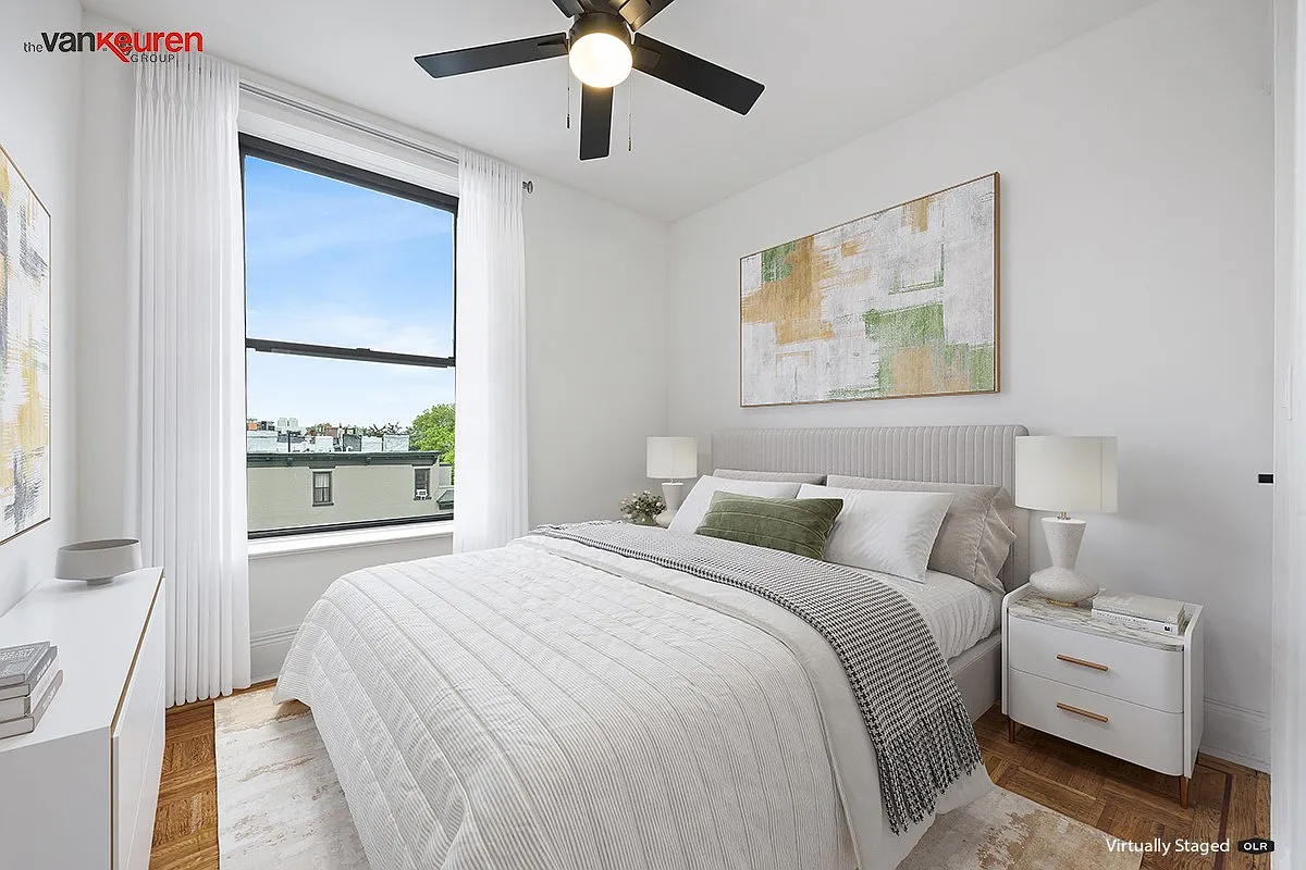 a virtually staged bedroom with a ceiling fan