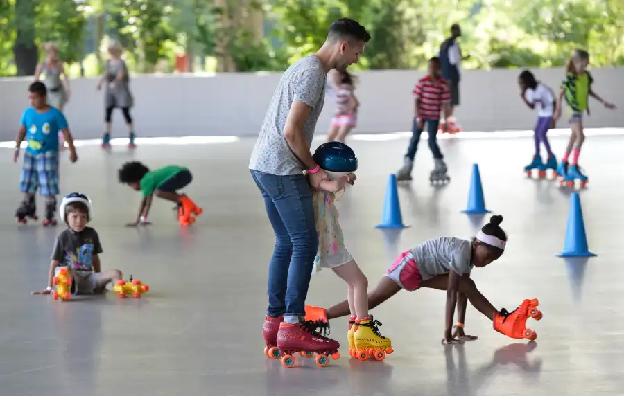 adults and children skating