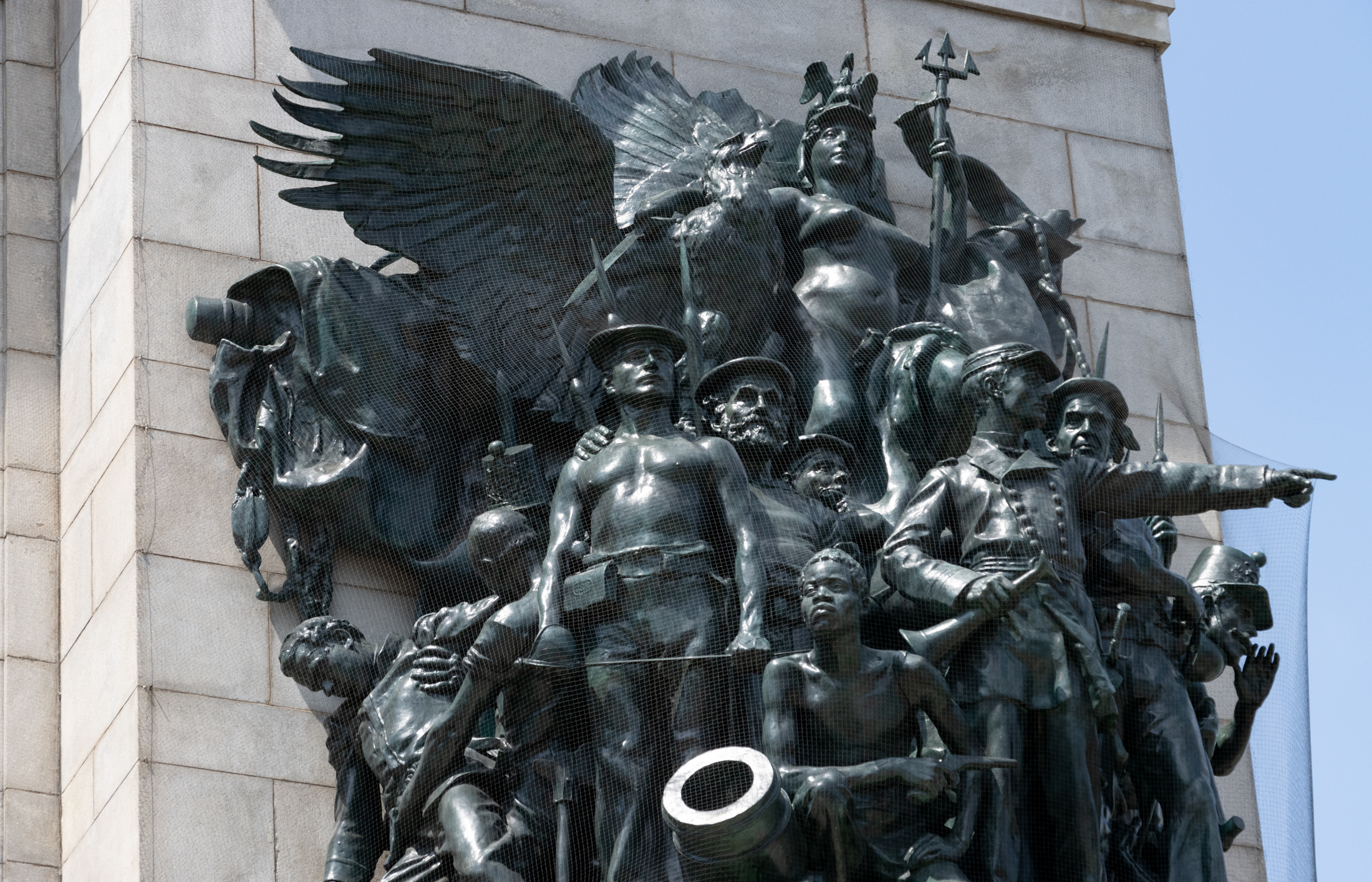 a closeup of one of the sculptural groups on the arch depicting soldiers and a giant eagle