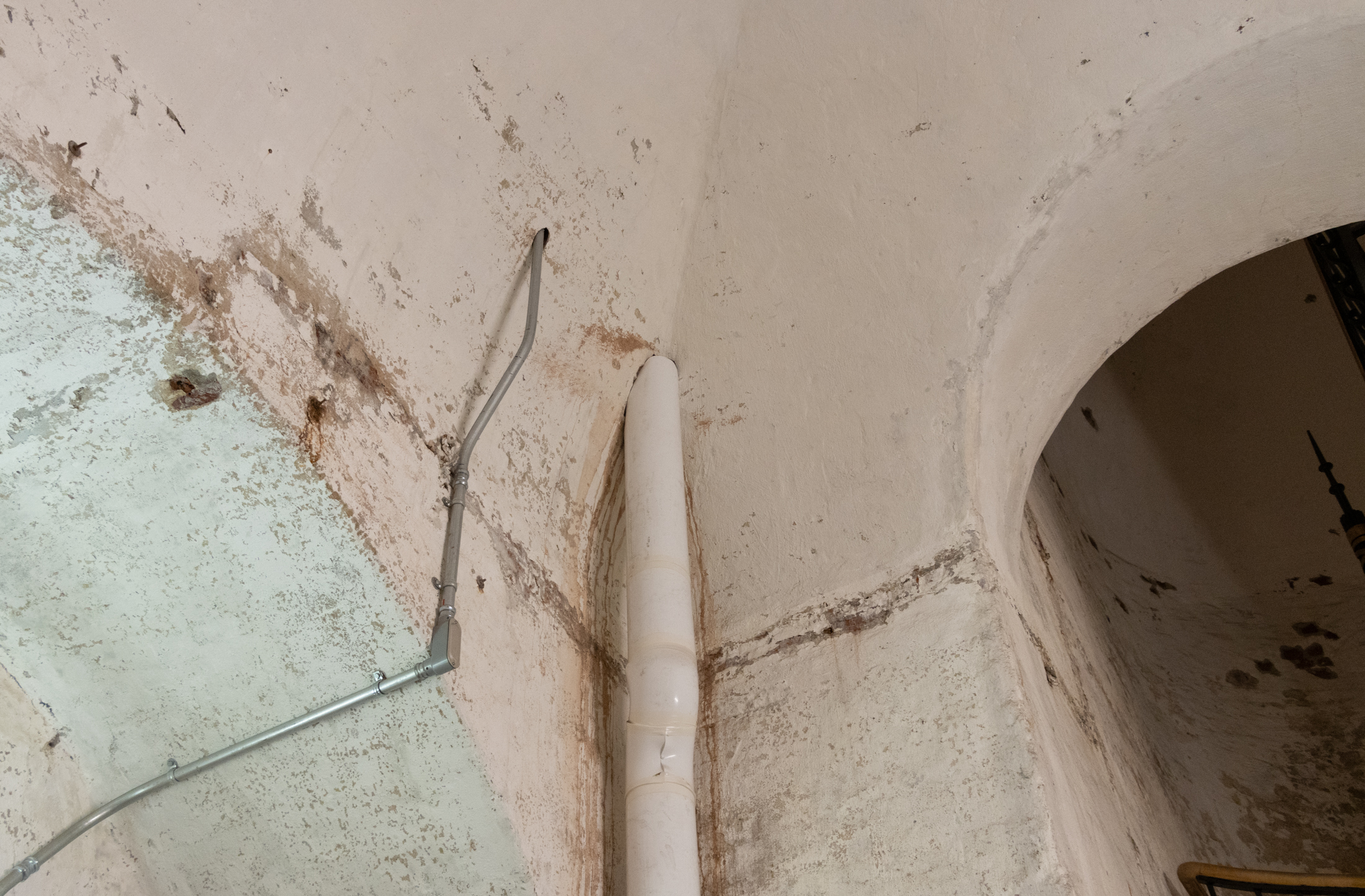a pipe runs along a wall