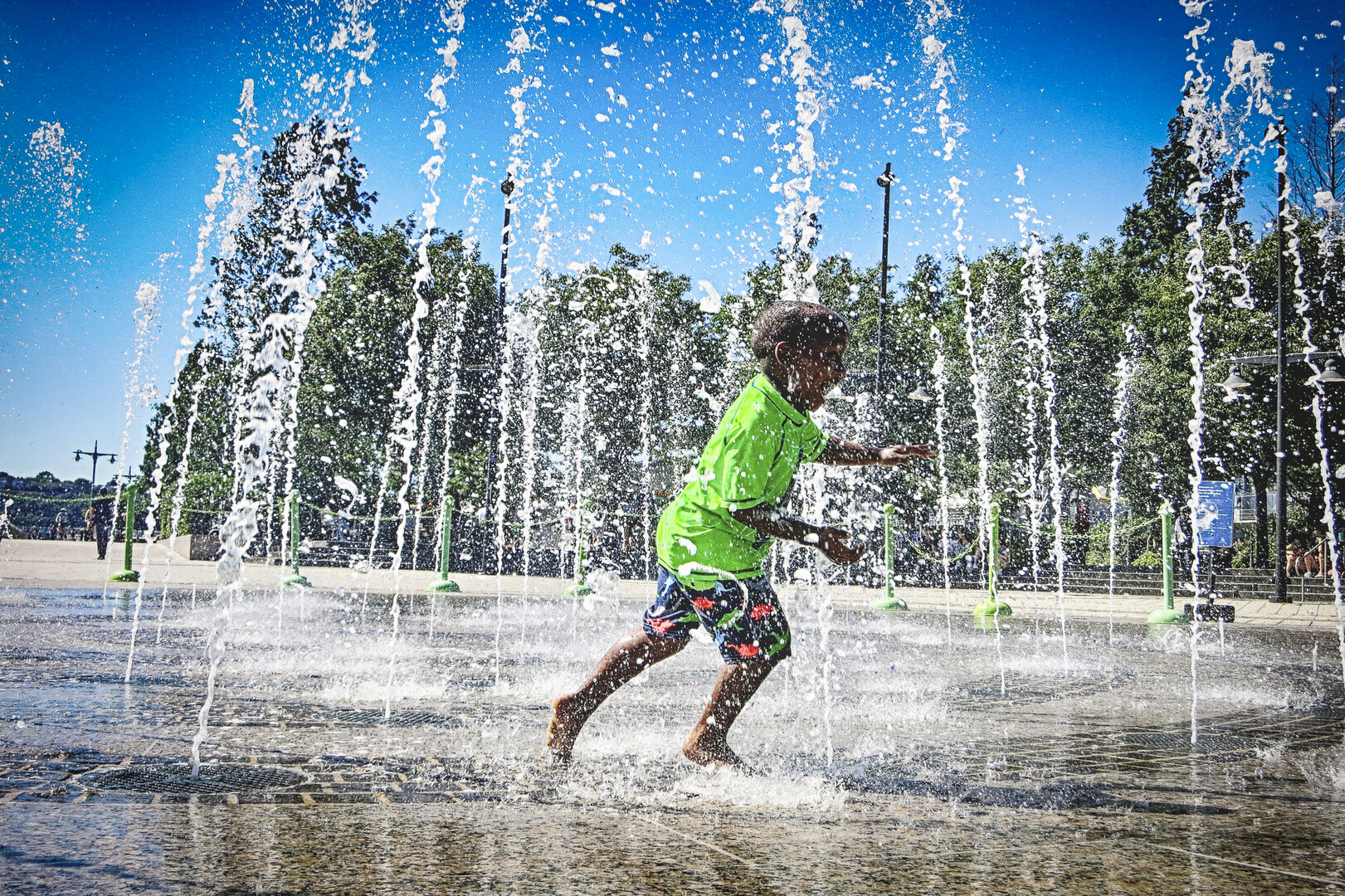 child running through water
