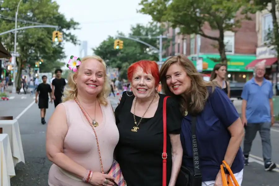 a group of people smiling at the event