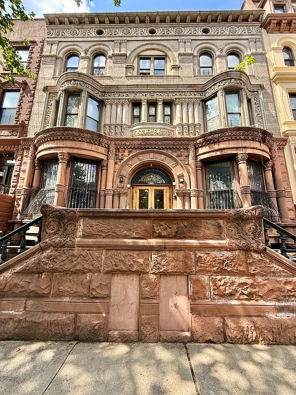 mansion exterior with a massive brownstone stoop