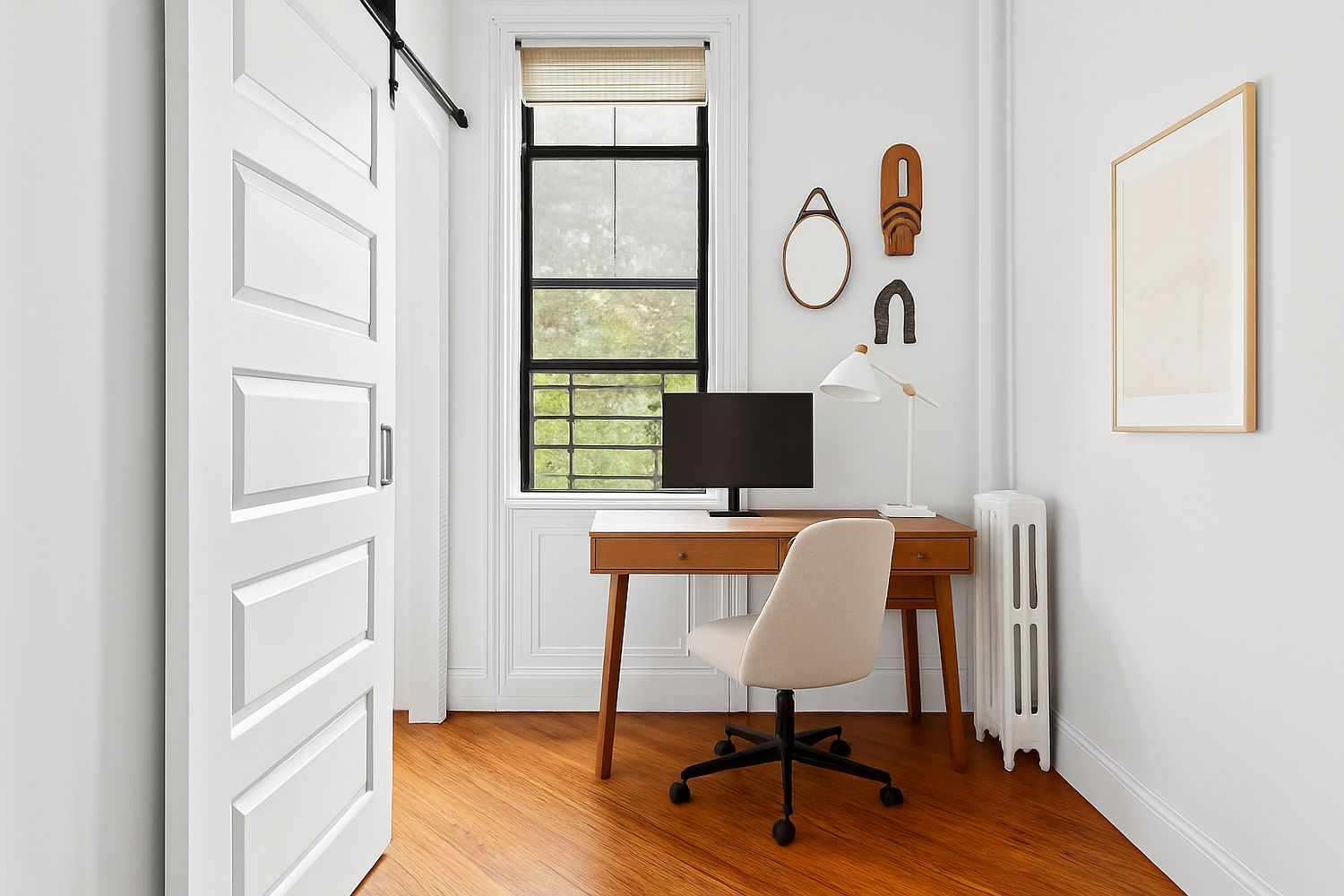 bedroom with a barn door, room for a desk