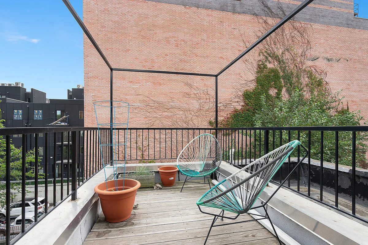 terrace off a bedroom with room for seating and planters