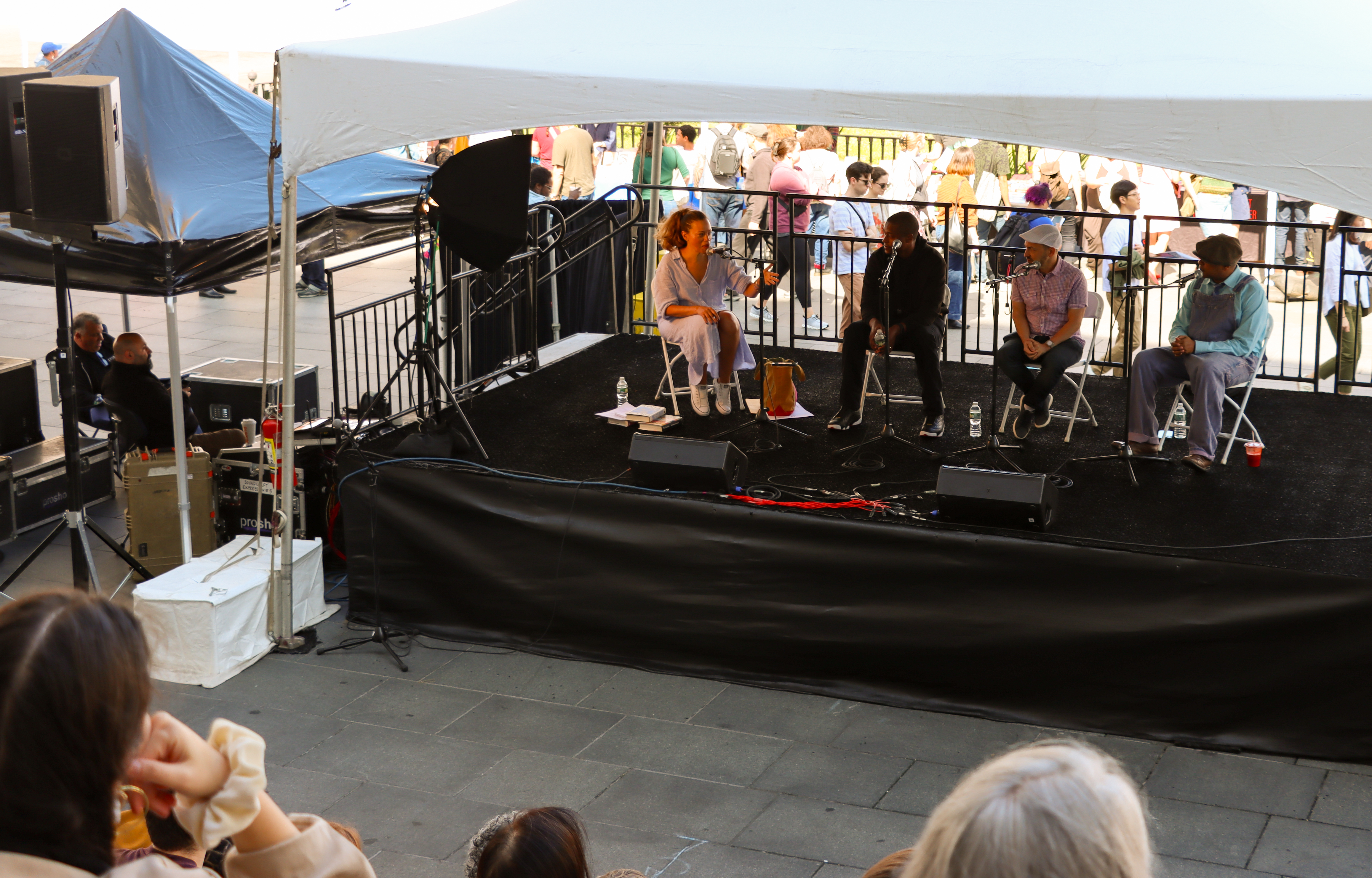 authors sitting on a stage
