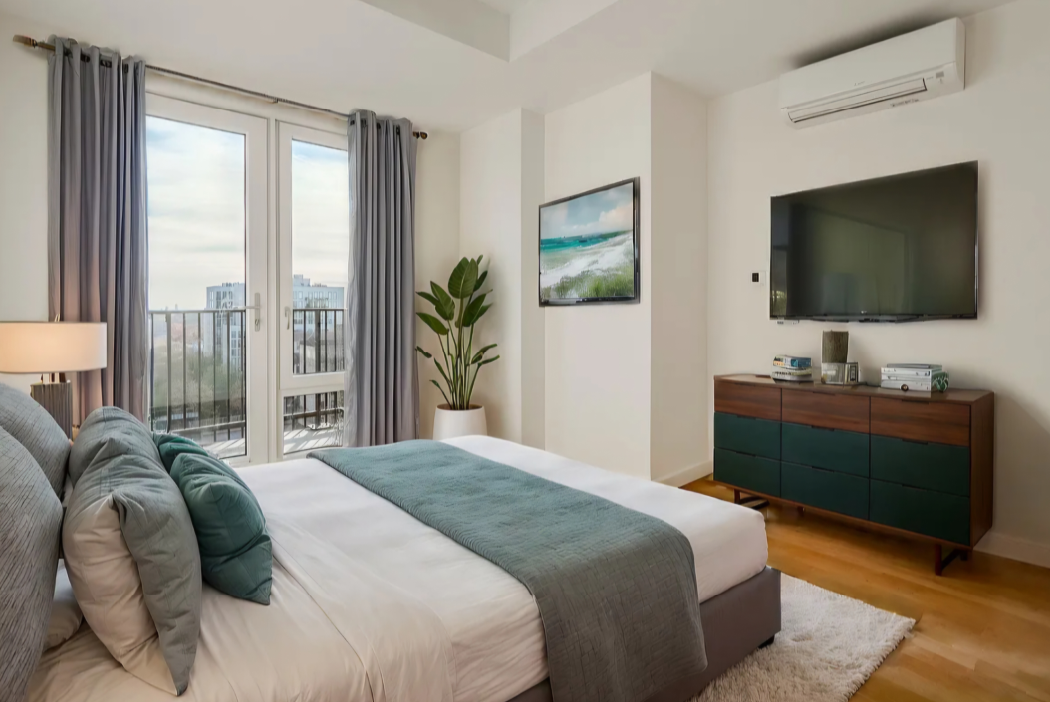 bedroom with glass doors to terrace