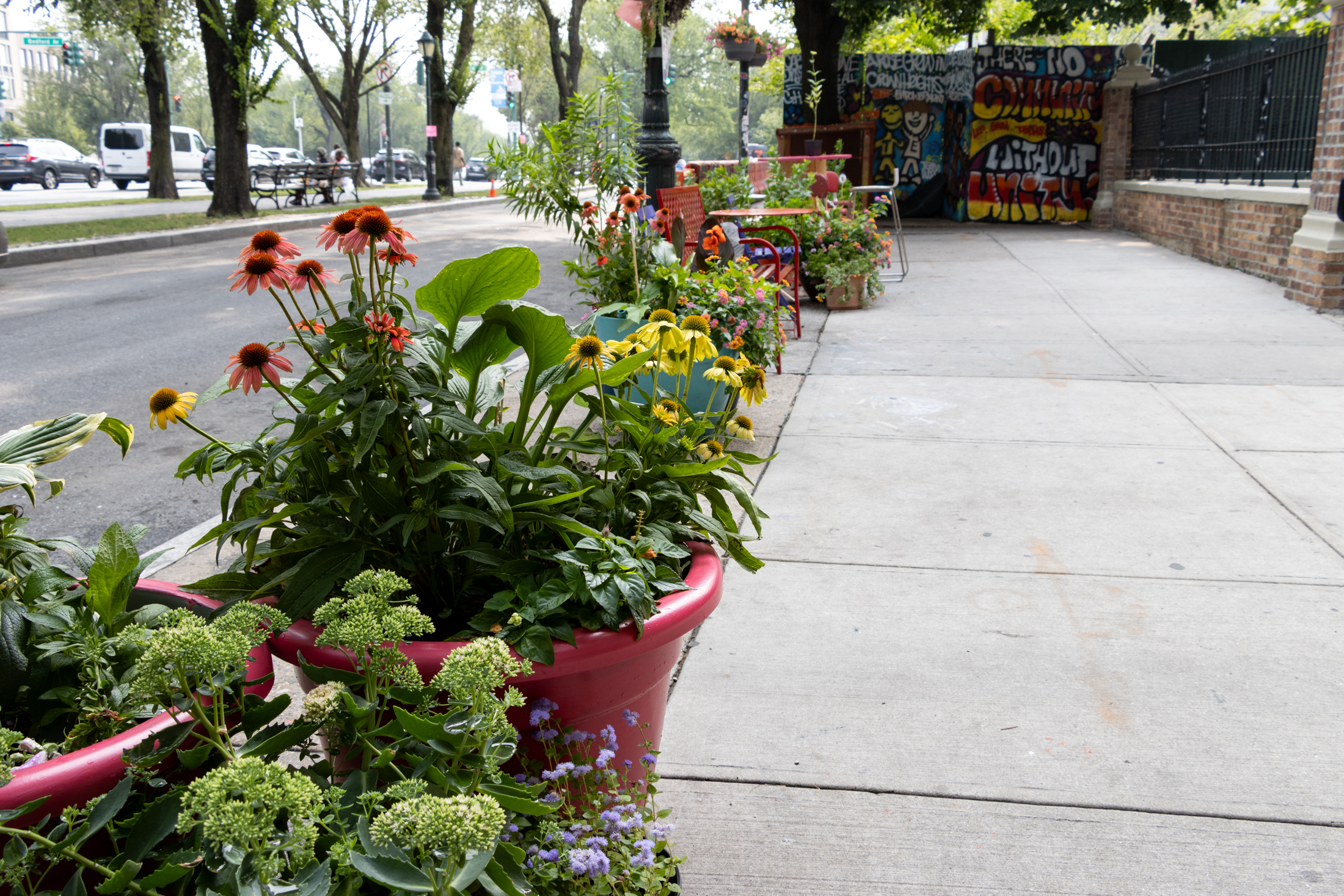 colorful planters on the sidewalk