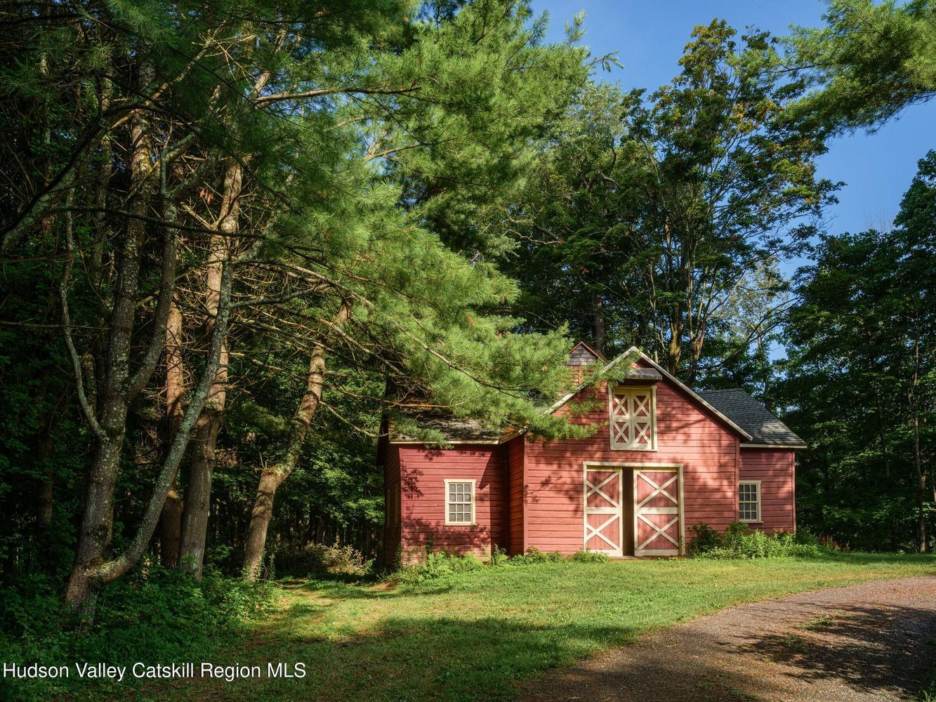 carriage house with red siding