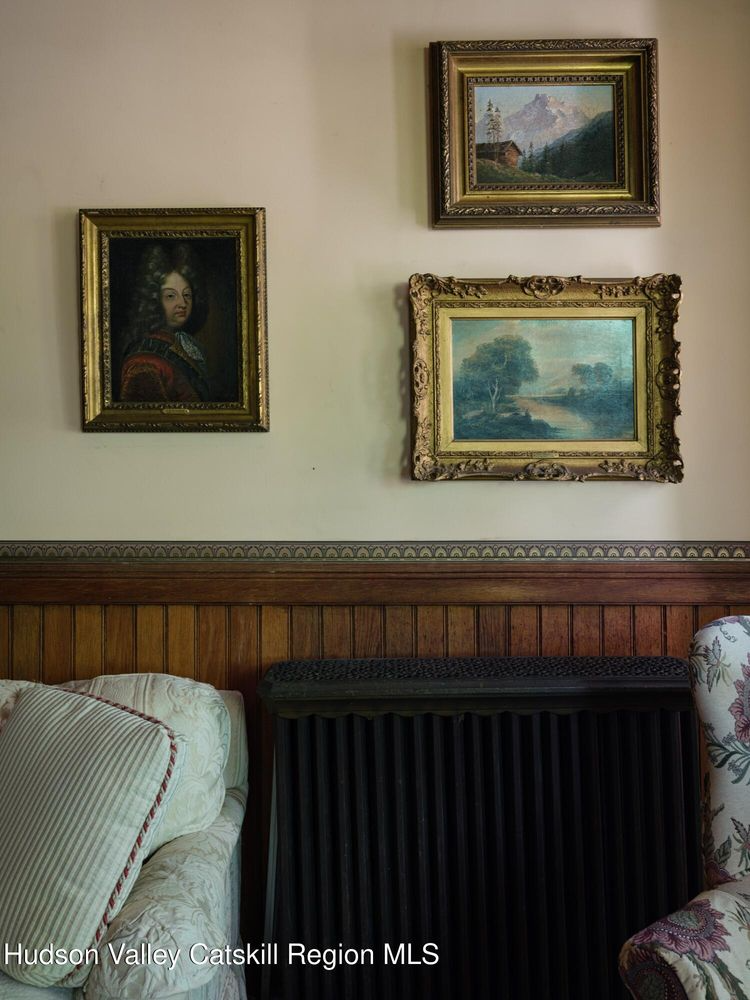 detail of wainscoting with framed art above