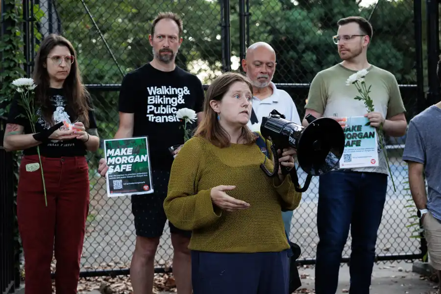 person with a megaphone at a vigil