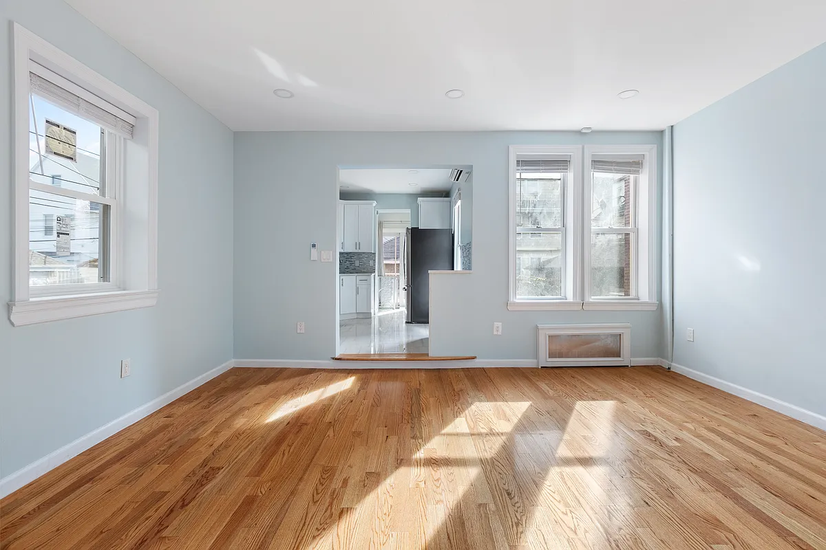 dining room with wood floor, blue walls