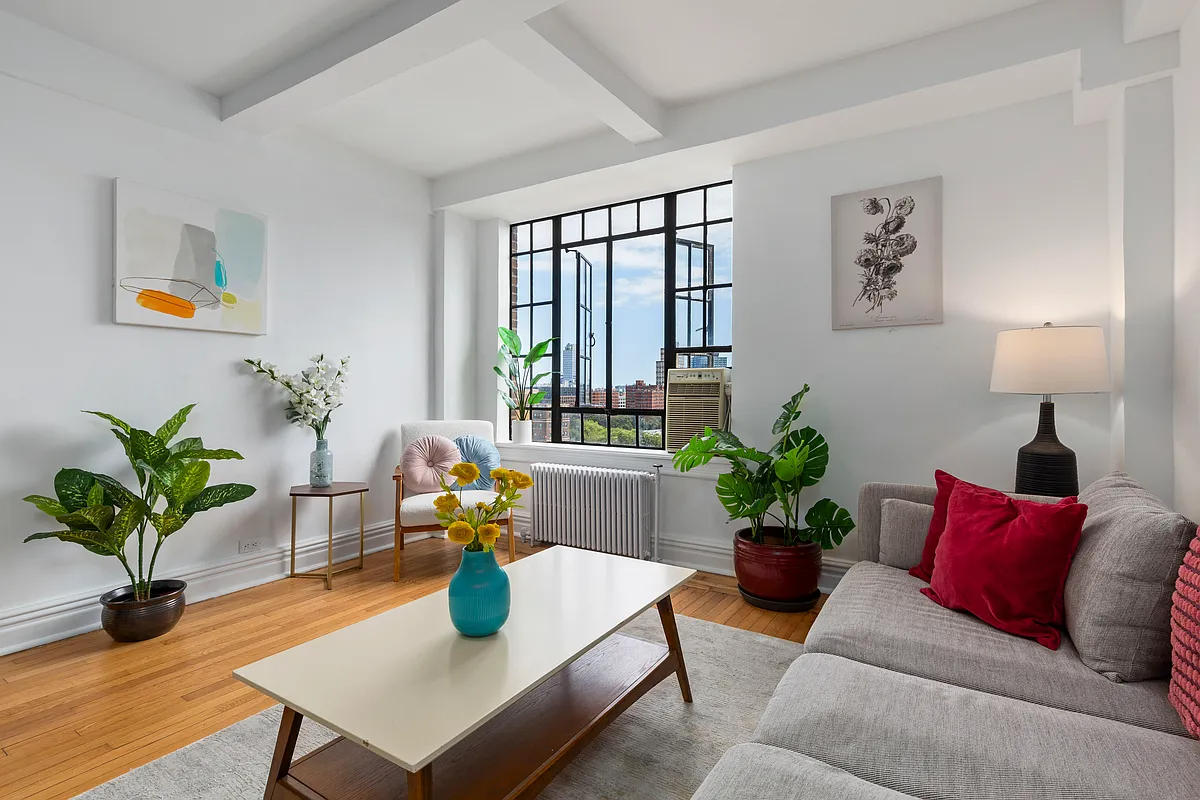 living space with wood floor, steel window