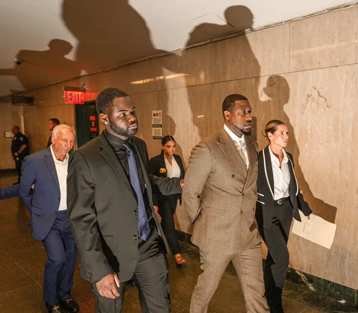 Glenn Martiin II, son of Ingrid Lewis-Martin, was indicted in an allegedly pay-to-play scheme with his mother. He is escorted by detectives in handcuffs at New York 