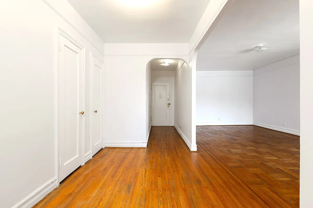 foyer with two closets, hallway to front door