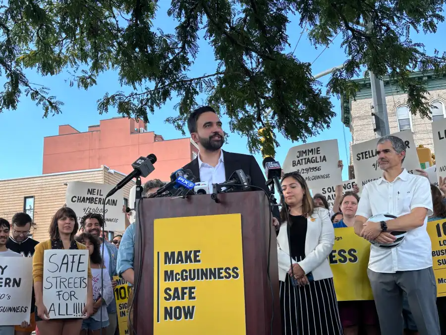 people at rally, man at podium