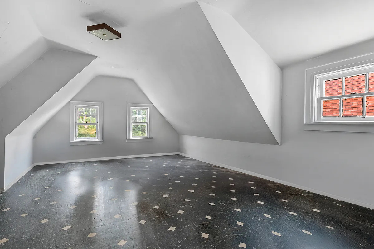 top floor bedroom with black and white linoleum floor