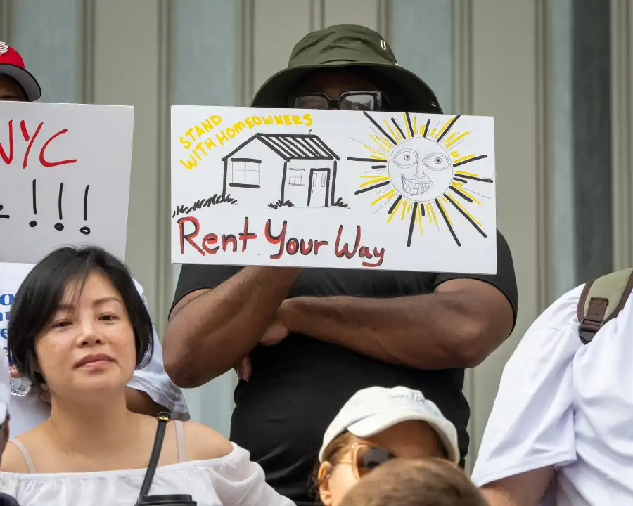 New Yorkers rally in Brooklyn in opposition to Local Law 18, which restricts short-term rentals like Airbnb and VRBO.