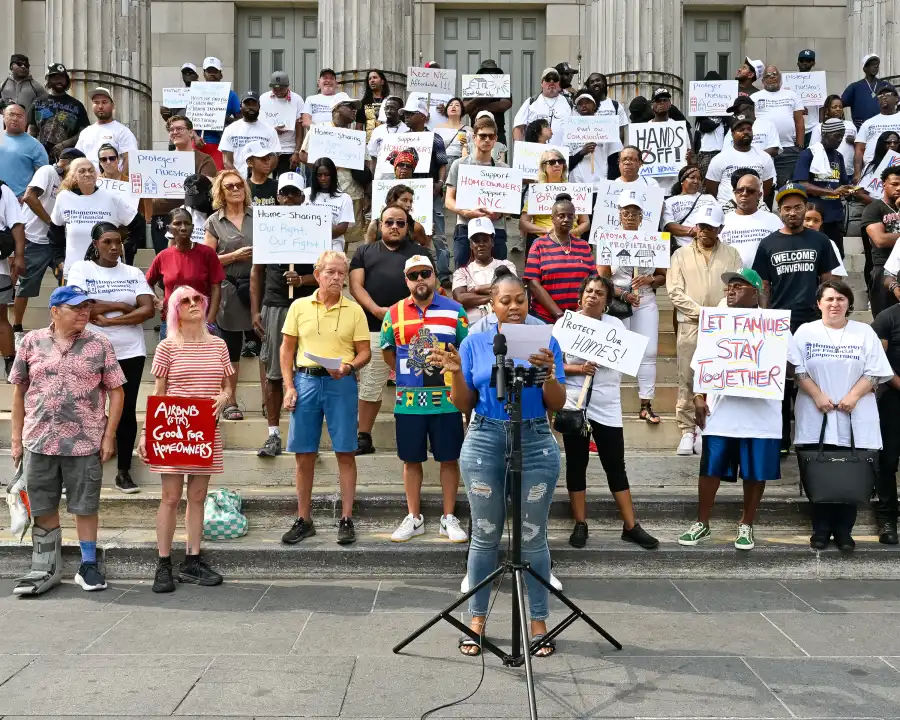 Supporters of Intro 1107 gather on the steps of Brooklyn Borough Hall to call for changes to New York City’s short-term rental law.