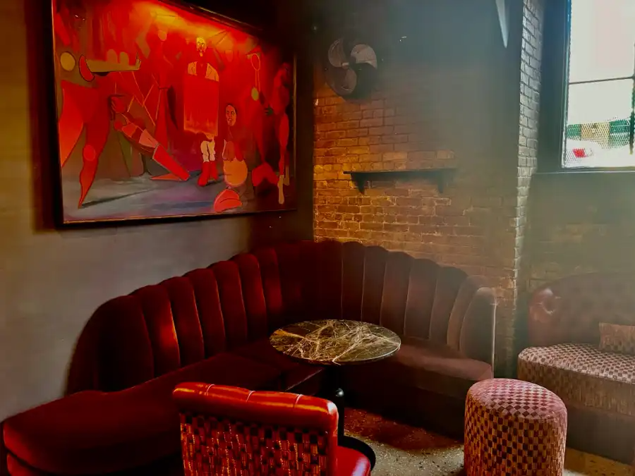 a red banquette in a corner