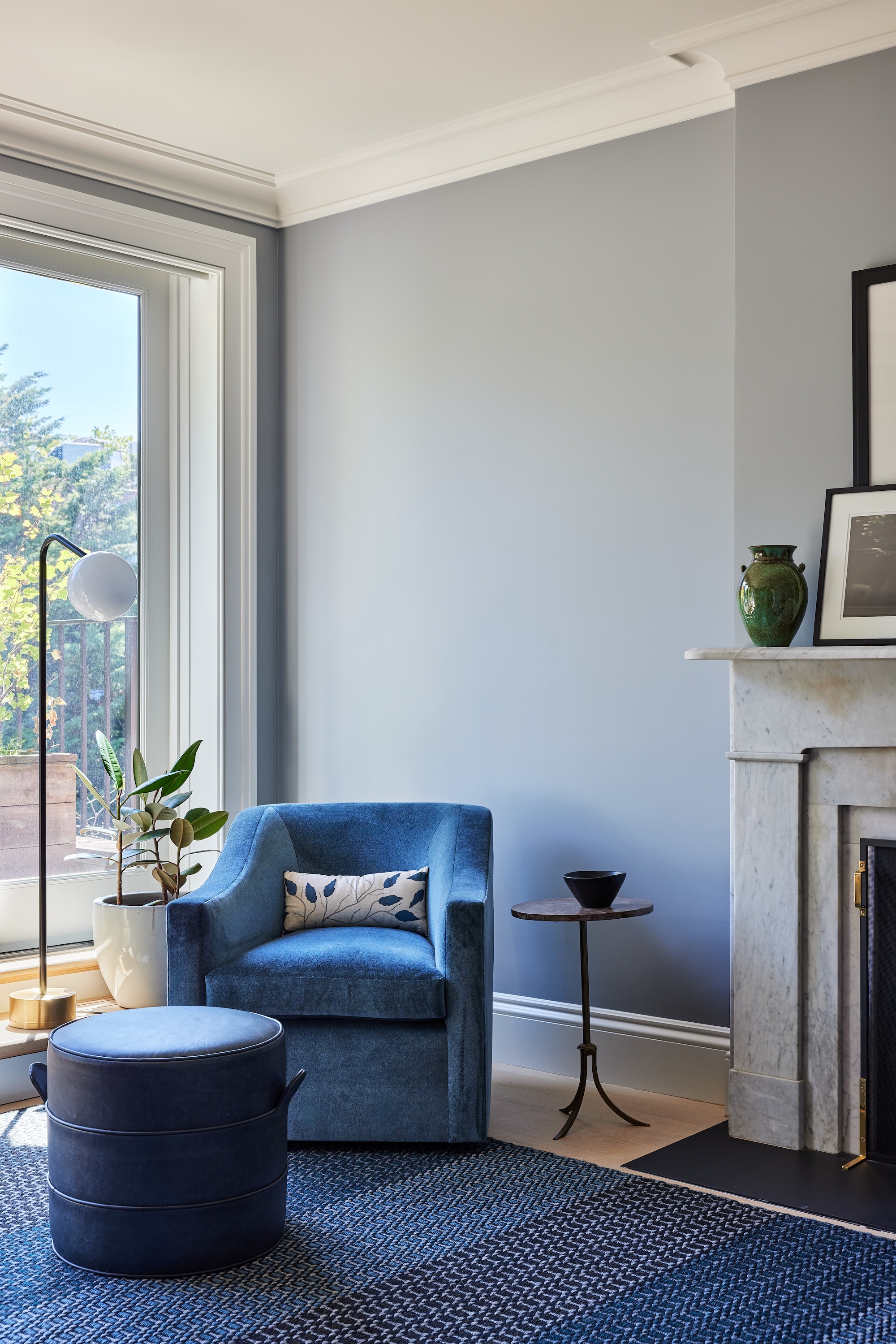 BLUE CHAIR LONG WINDOW FIREPLACE