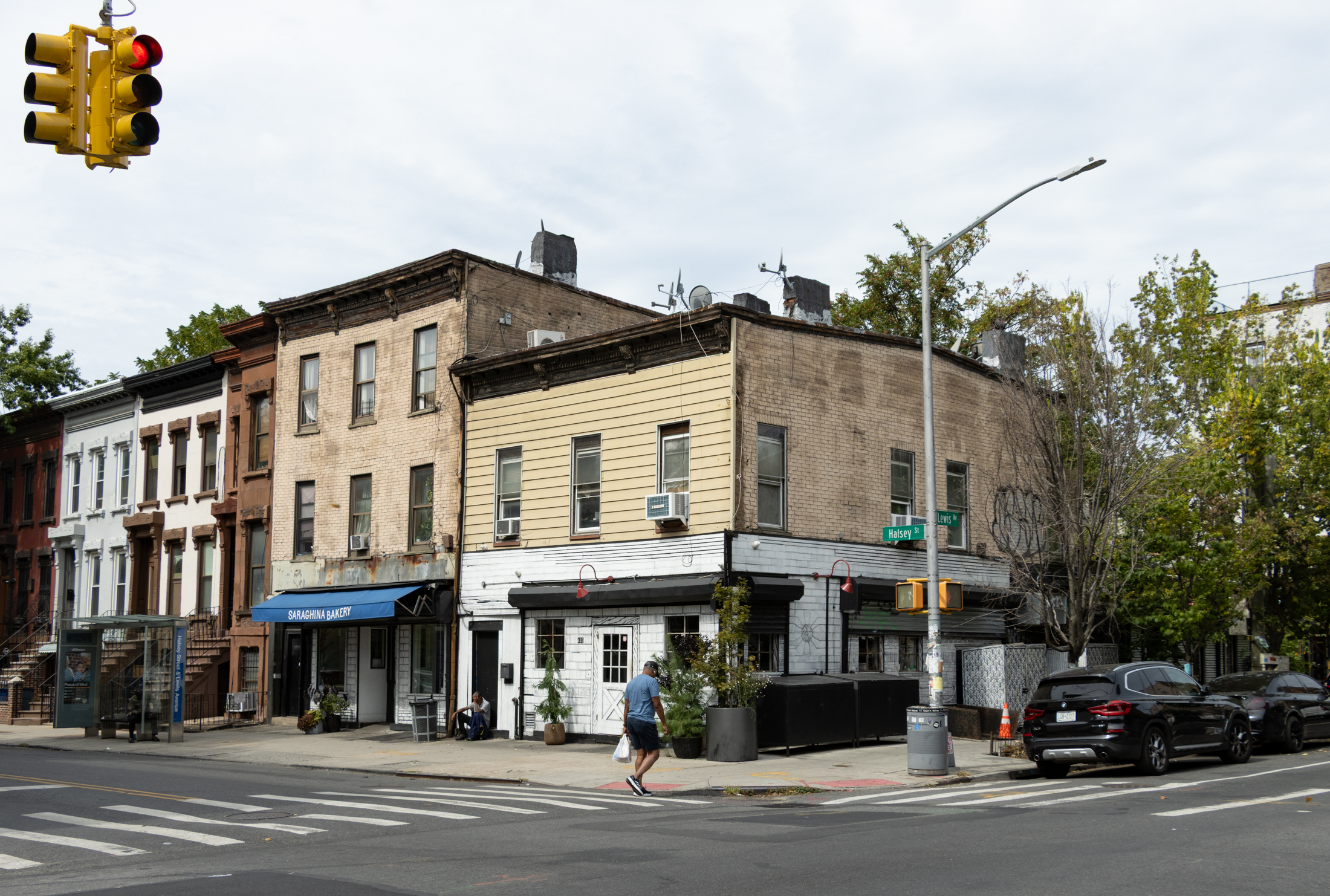 bed stuy corner with low scale buildings and saraghina retaurant