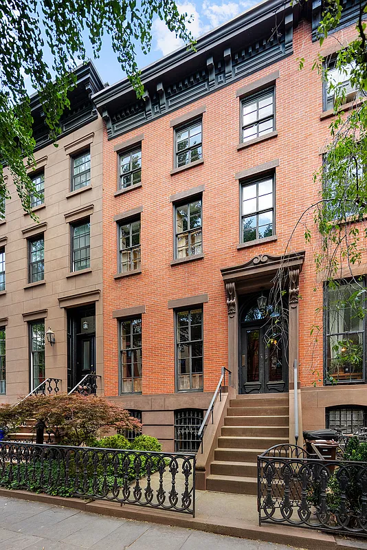 brick row house with a brownstone stoop