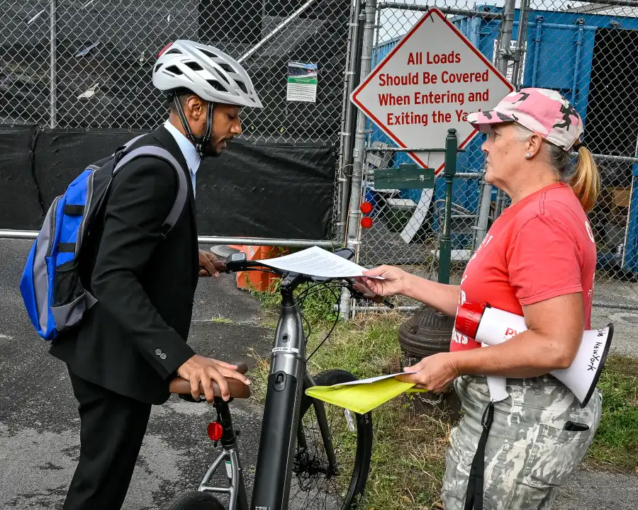 person handing out information
