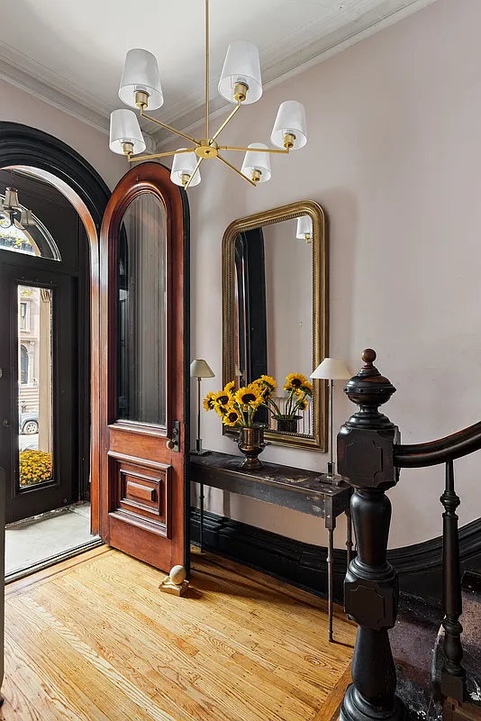 front entry with arched door from vestibule