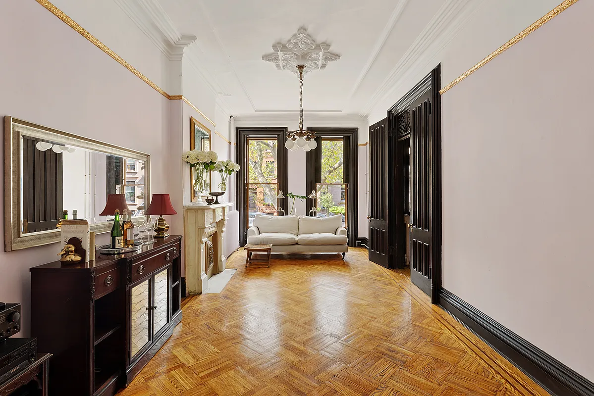 front parlor with marble mantel with a ceiling medallion