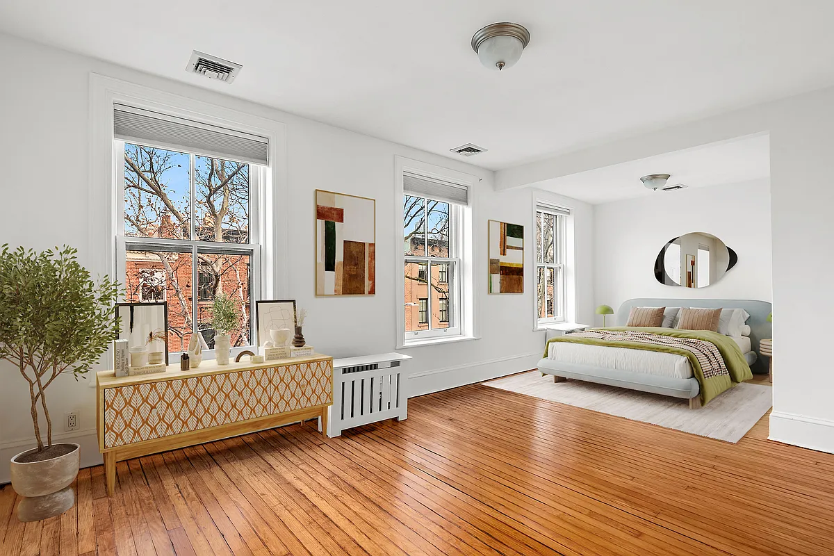 bedroom with bed nook, wood floors