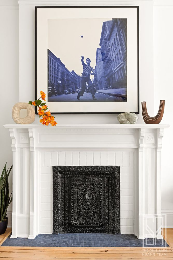 white mantel with hearth with contemporary blue tiles