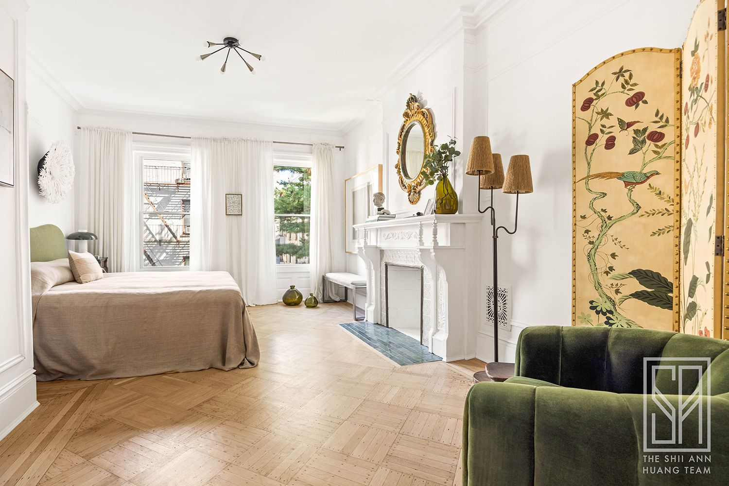 bedroom with two windows, white mantel
