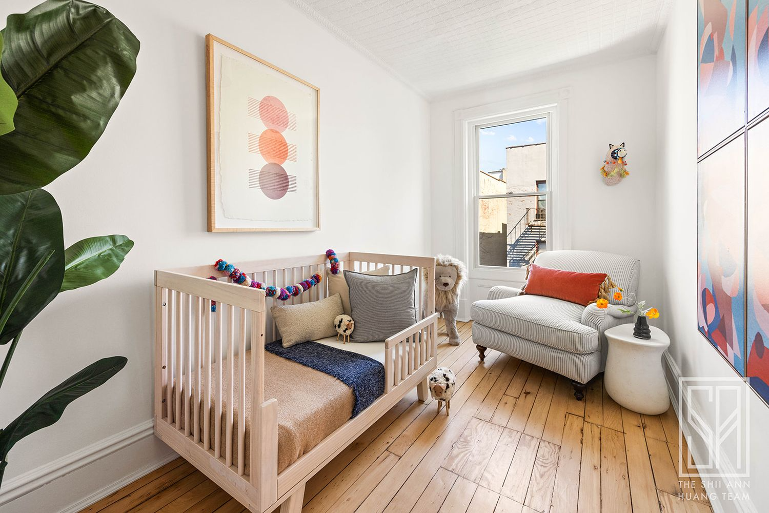 narrow bedroom set up as a nursery