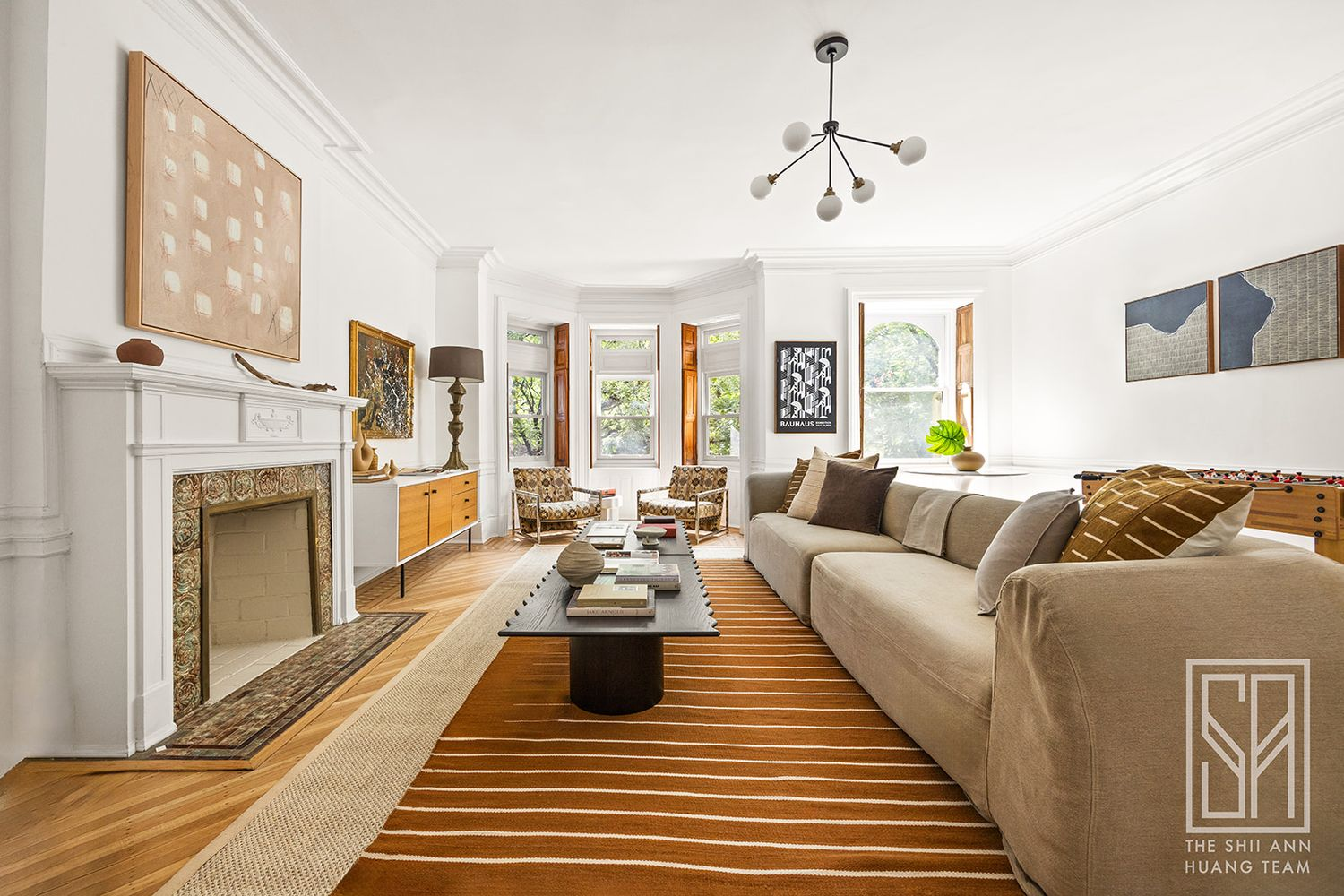 bedroom with wood floor, white mantel used as a family room