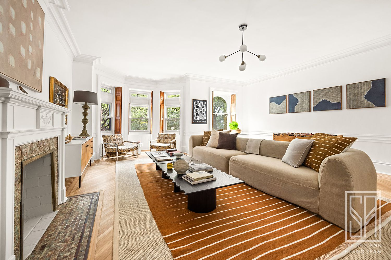 bedroom with wood floor, white mantel used as a family room