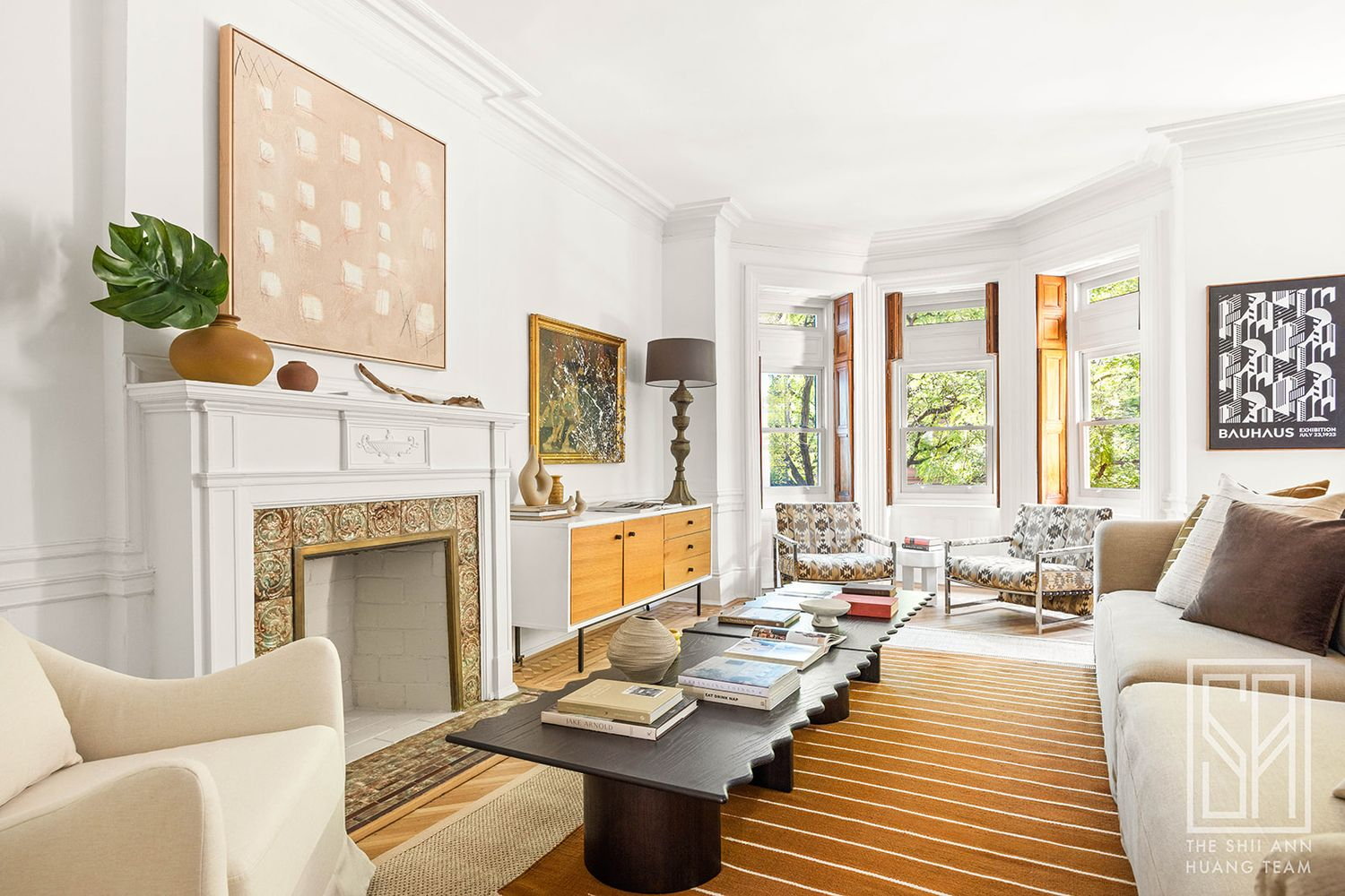 bedroom with wood floor, white mantel used as a family room