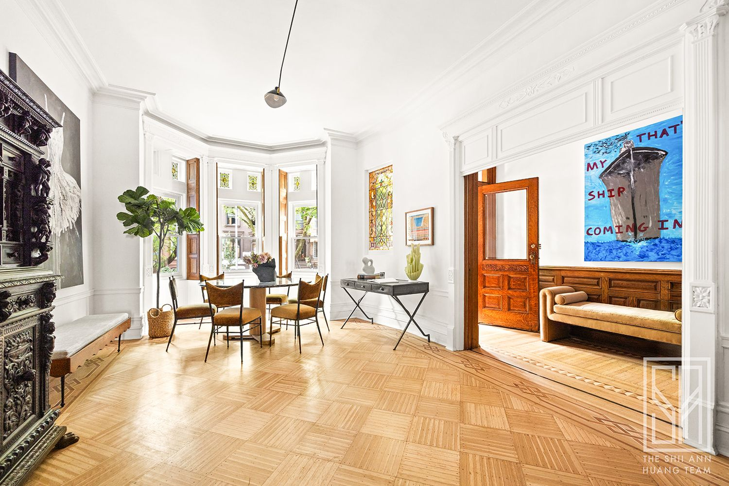 front parlor with dining area in the bay window