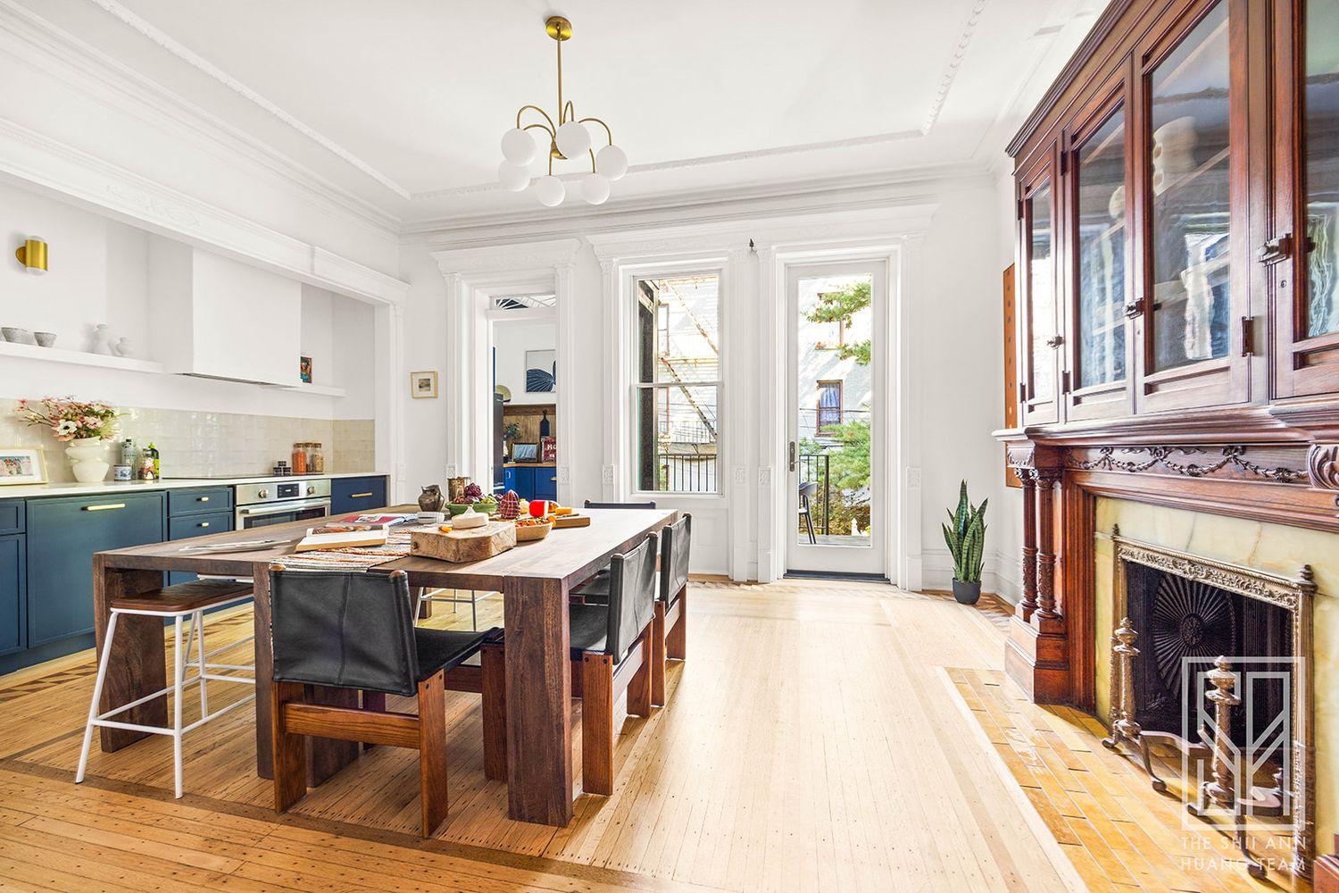 open plan kitchen and dining with blue lower cabinets