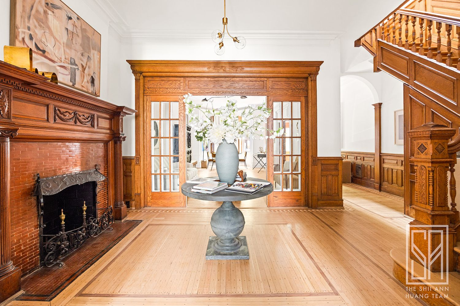 Middle parlor with mantel, view of stair