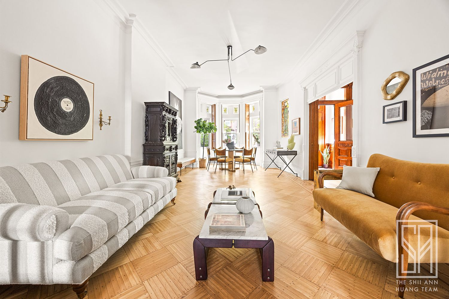 front parlor with stained glass, window shutters, wood floor
