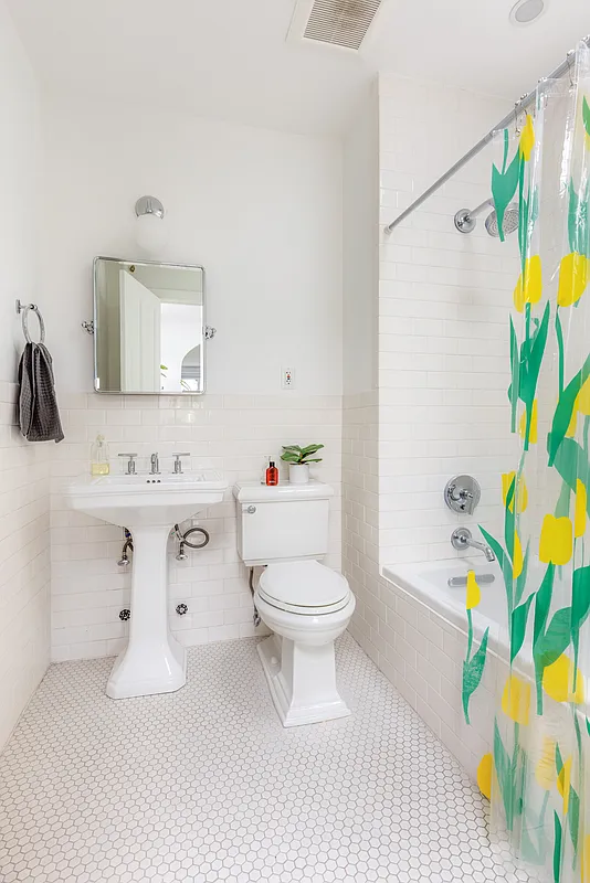 bathroom with white fixtures and tile