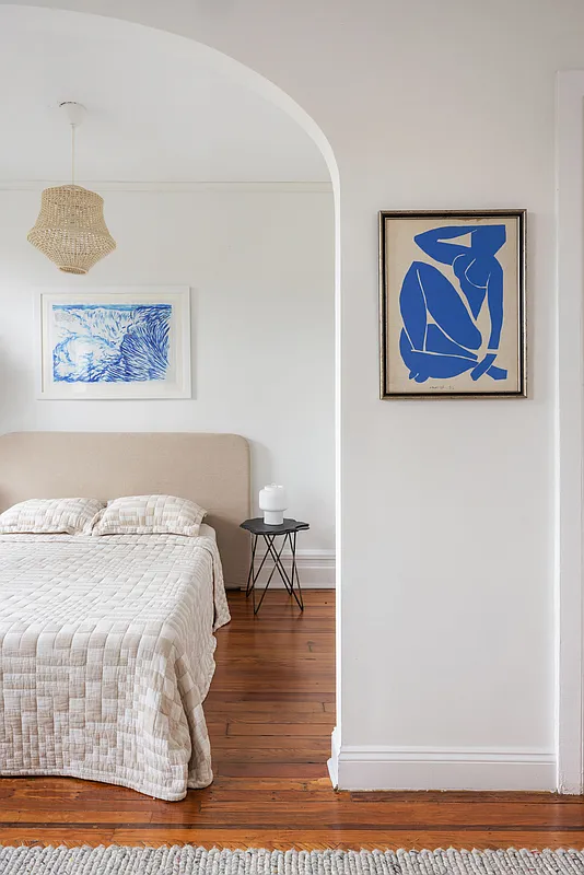 bedroom with wood floor, bed niche
