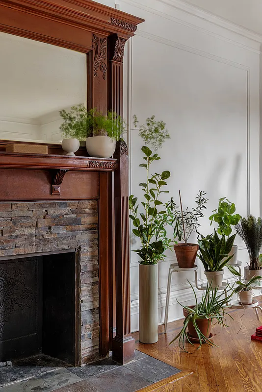 wood mantel with mirror, modern tile surround and hearth