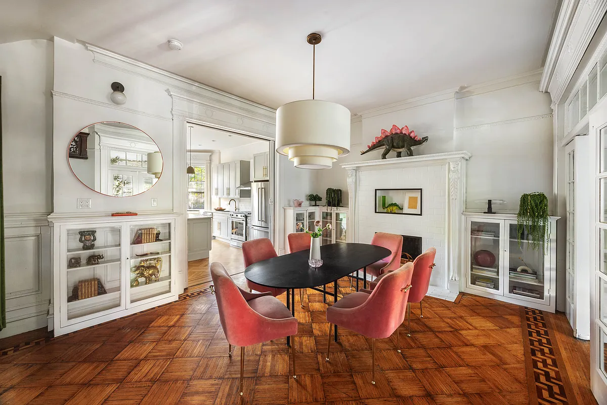 dining room wood floors, tall mantel with modern white tile surround,