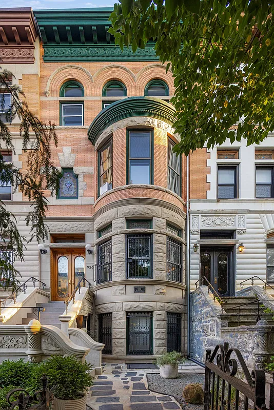 brick and limestone exterior with a bowed front