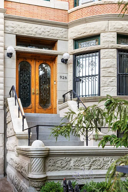 exterior detail with stoop leading to double wood doors